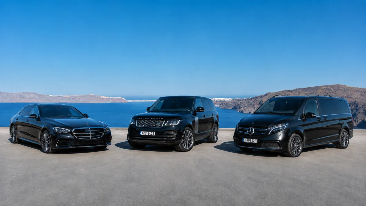 Mercedes S-Class, Range Rover and Mercedes V-Class luxury chauffeur fleet overlooking the Santorini caldera