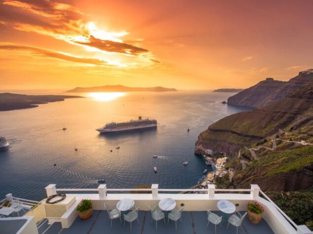 Cruise ship with stunning Santorini caldera views, perfect for a Santorini shore excursion.